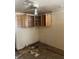 Outdated kitchen needing renovation, featuring upper cabinets and damaged flooring at 12049 132Nd Ave, Seminole, FL 33778