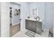 Updated bathroom with modern vanity, mirror, and glass-enclosed shower for a clean and sleek design at 1210 Bay Palm Blvd, Indian Rocks Beach, FL 33785