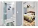 Stylish ensuite bathroom with walk-in shower, vanity, and access to the primary bedroom at 1210 Bay Palm Blvd, Indian Rocks Beach, FL 33785
