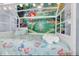 Charming bedroom with a custom bed frame and bright, cheerful Little Mermaid themed decor at 1210 Bay Palm Blvd, Indian Rocks Beach, FL 33785