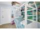 Charming bedroom with a custom bed frame, rug, and Little Mermaid themed decor at 1210 Bay Palm Blvd, Indian Rocks Beach, FL 33785
