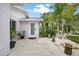 Charming front entrance featuring well-maintained landscaping and a welcoming pathway at 1210 Bay Palm Blvd, Indian Rocks Beach, FL 33785