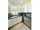 Stylish kitchen featuring modern cabinetry, elegant countertops, and modern appliances, creating a functional and beautiful space at 12334 Country White Cir, Tampa, FL 33635