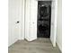 A stacked washer and dryer unit is located in an enclosed closet with bi-fold doors at 12334 Country White Cir, Tampa, FL 33635