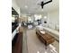 Open-concept living and dining area with modern furnishings, hardwood floors, and abundant natural light at 12334 Country White Cir, Tampa, FL 33635