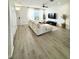 Inviting living area featuring an open layout, hardwood floors, modern decor, and ample natural light, perfect for gatherings at 12334 Country White Cir, Tampa, FL 33635