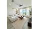 Spacious living room featuring modern decor, hardwood floors, and a comfortable seating area, perfect for relaxing at 12334 Country White Cir, Tampa, FL 33635