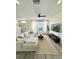 Bright and open living area featuring hardwood floors, modern decor, and a comfortable seating arrangement at 12334 Country White Cir, Tampa, FL 33635