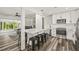 A modern kitchen with an island, stainless steel appliances, white cabinets and countertops at 1459 Joel Ln, Clearwater, FL 33755