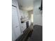Well-designed kitchenette with white cabinets, granite countertops, and a mini-refrigerator, optimized for space at 1459 Joel Ln, Clearwater, FL 33755