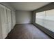 Bedroom with neutral carpet, big windows and large closet for storage at 14725 Morning Dr, Lutz, FL 33559
