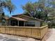 Well-maintained home showcasing a newly installed wooden fence surrounding the property at 14725 Morning Dr, Lutz, FL 33559