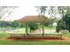 Outdoor pavilion with benches for gathering with views of the park and tennis courts at 14725 Morning Dr, Lutz, FL 33559