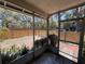 Screened porch offering views of the fenced backyard, perfect for relaxing outdoors at 14725 Morning Dr, Lutz, FL 33559