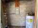 Utility room with a water heater and electrical panel, essential for home maintenance at 14725 Morning Dr, Lutz, FL 33559