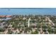 Aerial view showing home's location within a waterfront community and surrounding neighborhood at 1516 Santa Anna Dr, Dunedin, FL 34698