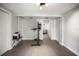 Spacious basement area with modern flooring and a glimpse into a cozy living space at 1516 Santa Anna Dr, Dunedin, FL 34698