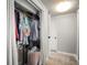 Open closet with rod and shelf storage solutions, plus an adjacent hallway at 1516 Santa Anna Dr, Dunedin, FL 34698