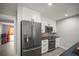 Sleek kitchen with stainless steel appliances and ample cabinet space at 1516 Santa Anna Dr, Dunedin, FL 34698