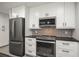 Sleek kitchen with stainless steel appliances and ample cabinet space at 1516 Santa Anna Dr, Dunedin, FL 34698