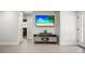 Bright open living room with modern furniture and a large flat-screen TV at 1516 Santa Anna Dr, Dunedin, FL 34698