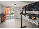 Office featuring a stand up desk, shelving, and a sliding glass door to the backyard at 1516 Santa Anna Dr, Dunedin, FL 34698