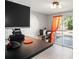 Office space featuring a black desk and an exterior view through a sliding glass door at 1516 Santa Anna Dr, Dunedin, FL 34698