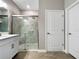Modern bathroom with glass-enclosed shower, sleek vanity, and contemporary fixtures at 16913 Anchor Root St, Wimauma, FL 33598