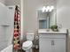 Functional bathroom featuring a shower, a toilet, and a vanity with ample counter space at 16913 Anchor Root St, Wimauma, FL 33598