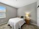 Bedroom with a cozy atmosphere, featuring a neutral color scheme and soft lighting at 16913 Anchor Root St, Wimauma, FL 33598
