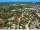 Aerial view of neighborhood showcasing the property's location among surrounding homes and green spaces at 1799 Dixie Hwy, Tarpon Springs, FL 34689
