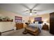 A cozy bedroom with a ceiling fan and windows, offering a bright and comfortable space at 1799 Dixie Hwy, Tarpon Springs, FL 34689