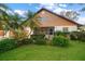 Well-maintained home with beautiful landscaping and a cozy screened-in porch at 1799 Dixie Hwy, Tarpon Springs, FL 34689