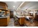 Spacious kitchen featuring an island bar, adjacent dining area, and wood floors at 1799 Dixie Hwy, Tarpon Springs, FL 34689