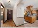 Welcoming entryway featuring hardwood floors, a classic front door, and kitchen island at 1799 Dixie Hwy, Tarpon Springs, FL 34689