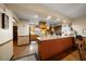 Well-equipped kitchen with wood cabinets, an island bar, and stainless steel appliances at 1799 Dixie Hwy, Tarpon Springs, FL 34689