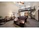 A living room featuring a high ceiling, a spiral staircase and comfortable furniture at 1799 Dixie Hwy, Tarpon Springs, FL 34689