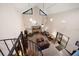 A living room with a fireplace, high ceilings, spiral staircase, and comfortable seating at 1799 Dixie Hwy, Tarpon Springs, FL 34689