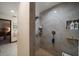 A tiled shower with a built-in niche for storage, offering a modern and functional space at 1799 Dixie Hwy, Tarpon Springs, FL 34689