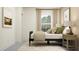 Bedroom featuring a bed with a wooden headboard, soft linens, and neutral tones at 18136 Serene Lake Loop, Lutz, FL 33548