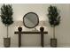 Elegant foyer with console table, decorative mirror, lamps, and potted plants at 18136 Serene Lake Loop, Lutz, FL 33548