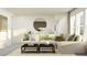 Bright and airy living room featuring a sectional sofa, modern decor, and a wet bar at 18136 Serene Lake Loop, Lutz, FL 33548