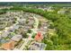 Aerial shot highlighting the home within a community, with swimming pools and landscaping at 18444 Eastwyck Dr, Tampa, FL 33647