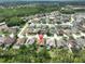 Aerial view of a residential neighborhood showcasing the home's location amidst lush greenery and well-maintained properties at 18444 Eastwyck Dr, Tampa, FL 33647