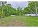Large backyard with a white fence at 18444 Eastwyck Dr, Tampa, FL 33647