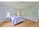 Spacious bedroom featuring a ceiling fan, hardwood floors, and a closet at 18444 Eastwyck Dr, Tampa, FL 33647