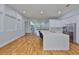 Expansive kitchen with a large island, white cabinetry, stainless steel appliances, and an open layout at 18444 Eastwyck Dr, Tampa, FL 33647