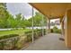 Screened patio looking out to the backyard at 18444 Eastwyck Dr, Tampa, FL 33647