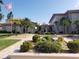 Inviting community entrance with lush landscaping, fountain, and well-maintained buildings at 19029 Us Highway 19 N # 5-16, Clearwater, FL 33764