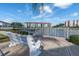 Beautiful view of the community with a white bench, waterway, bridge and well-maintained landscaping at 19029 Us Highway 19 N # 5-16, Clearwater, FL 33764